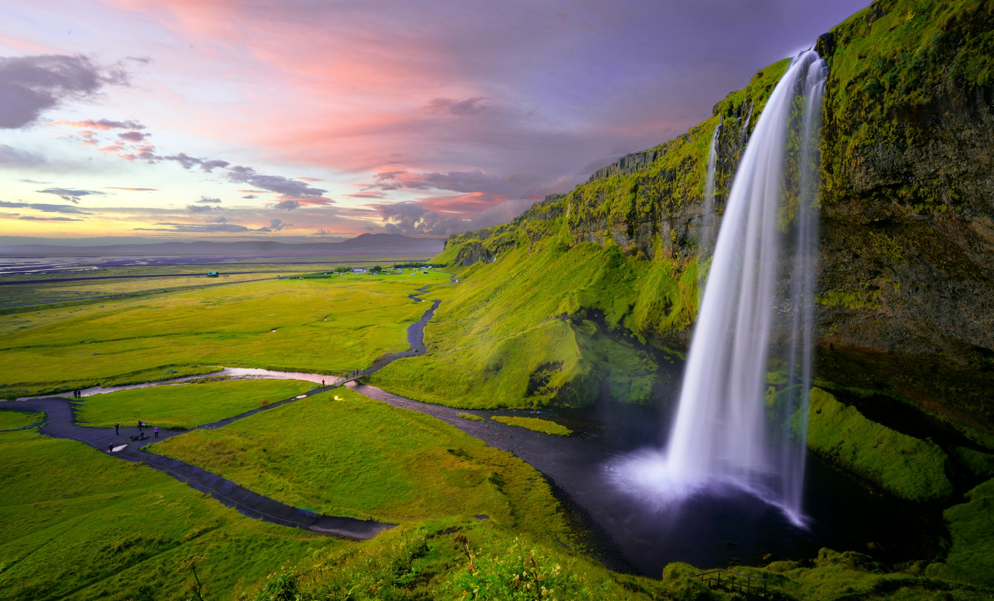 An Icelandic waterfall at sunset